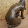 escultura decoración bronce chica lago